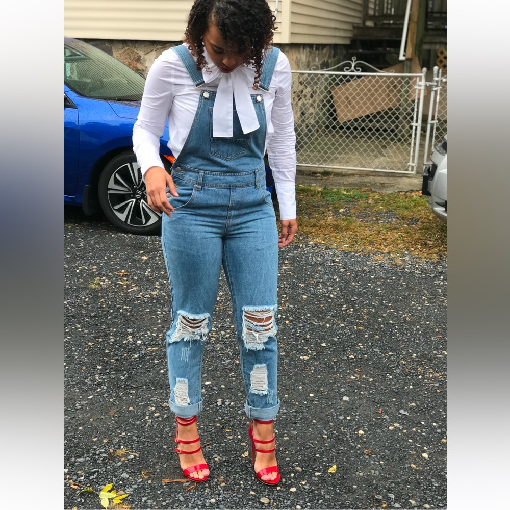 Distressed denim overalls.